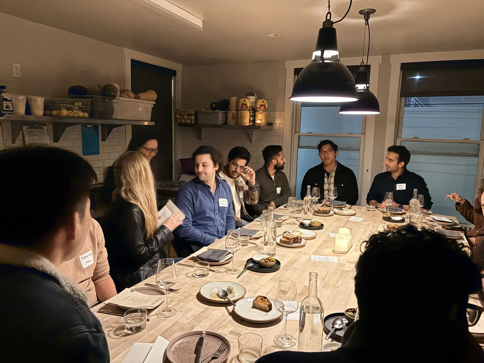 Founding engineers at a First Commits dinner table